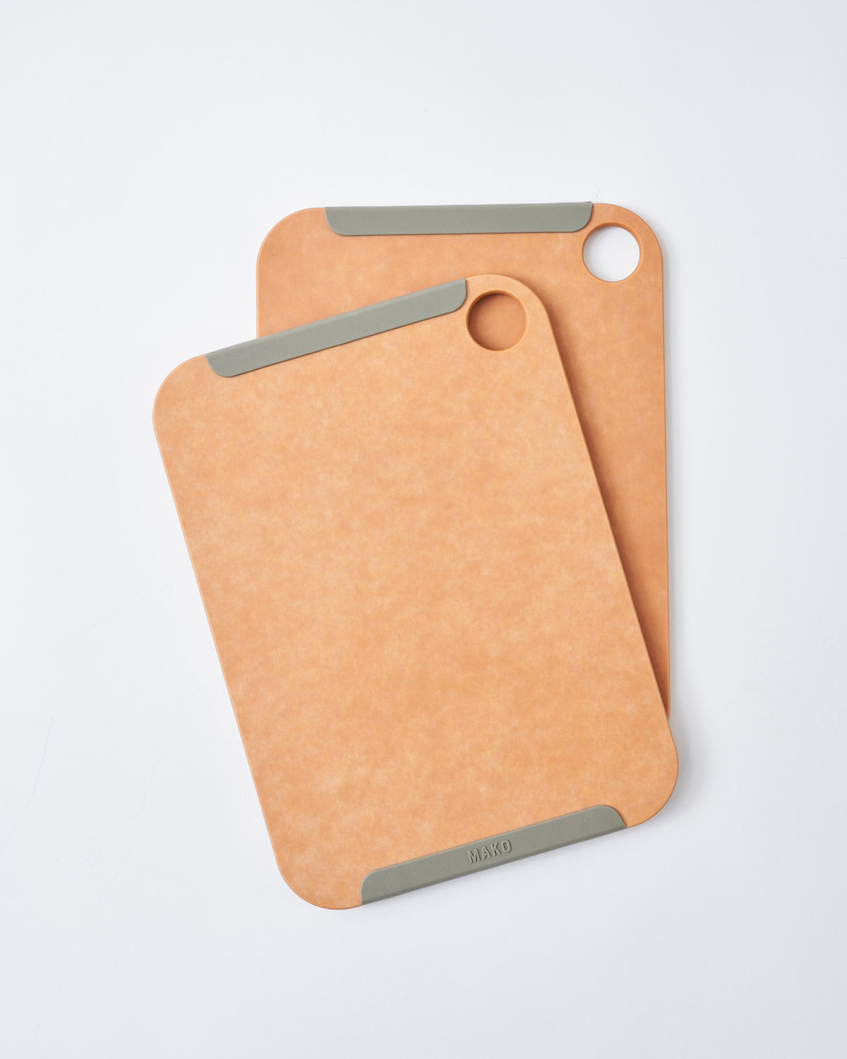 Set of two non-slip wood fibre chopping boards with rounded corners and grey grips