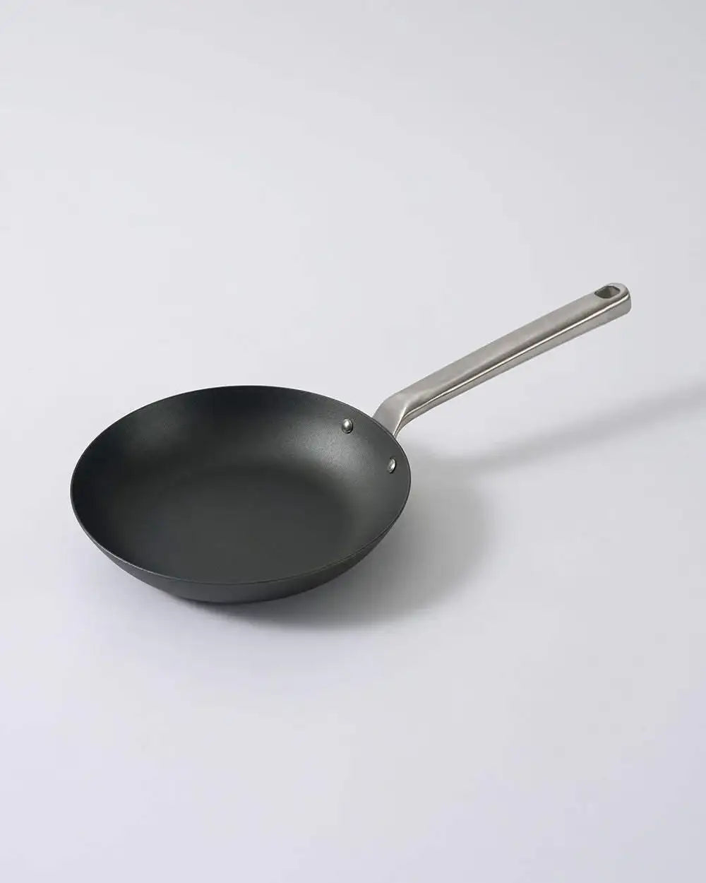 Black Mako non-stick frying pan with silver metal handle on white background