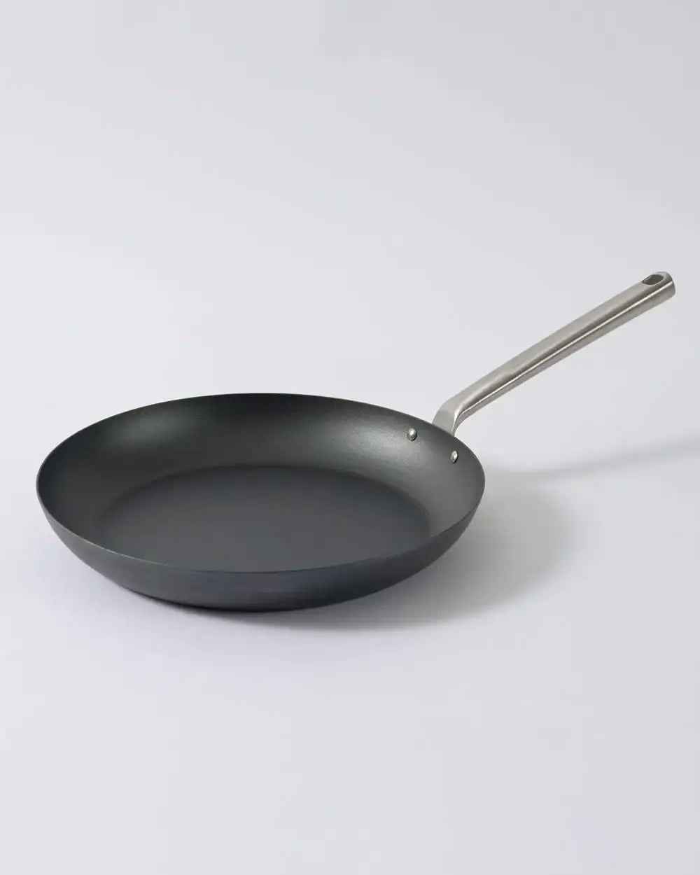 Mako black steel 31cm frying pan with stainless steel handle by Marion Grasby on white background
