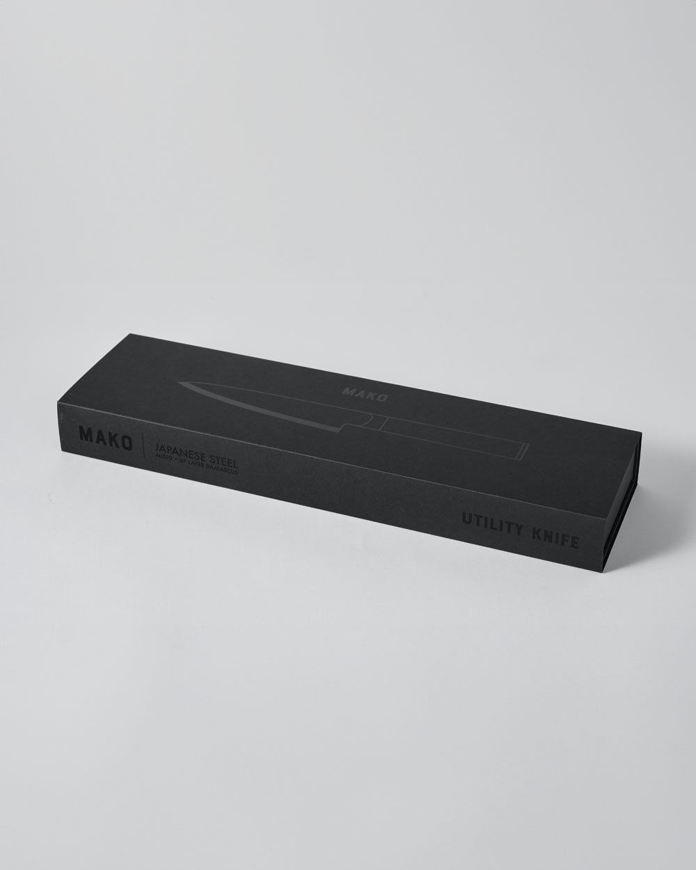 Black box packaging for MAKO Japanese steel utility knife on white background