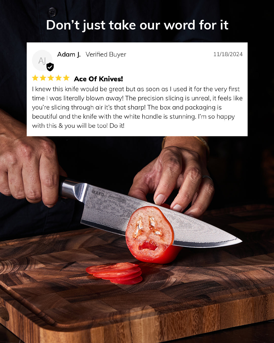Chef slicing tomato with stainless steel Japanese chef knife on wooden cutting board